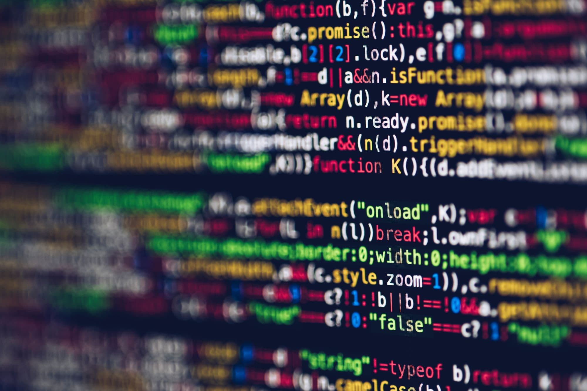 Close up of code in yellow, white, red, green, and blue